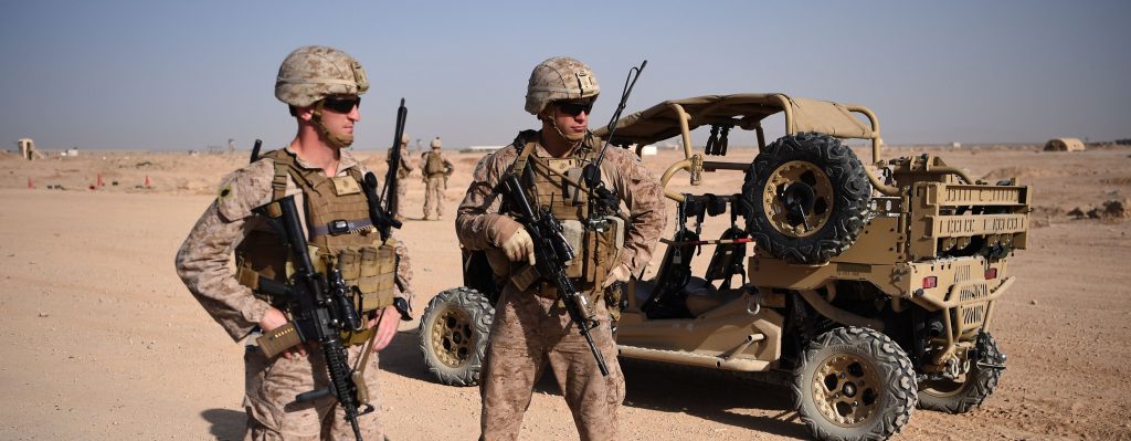 n this file photo taken on August 27, 2017 US Marines keep watch as unseen Afghan National Army soldiers participate in an IED (improvised explosive device) training exercise at the Shorab Military Camp in Lashkar Gah in the Afghan province of Helmand. - The Trump administration is getting ready to pull back thousands of troops from Afghanistan as part of a peace deal with the Taliban to begin negotiating directly with the Afghan government. (Photo by WAKIL KOHSAR / AFP)