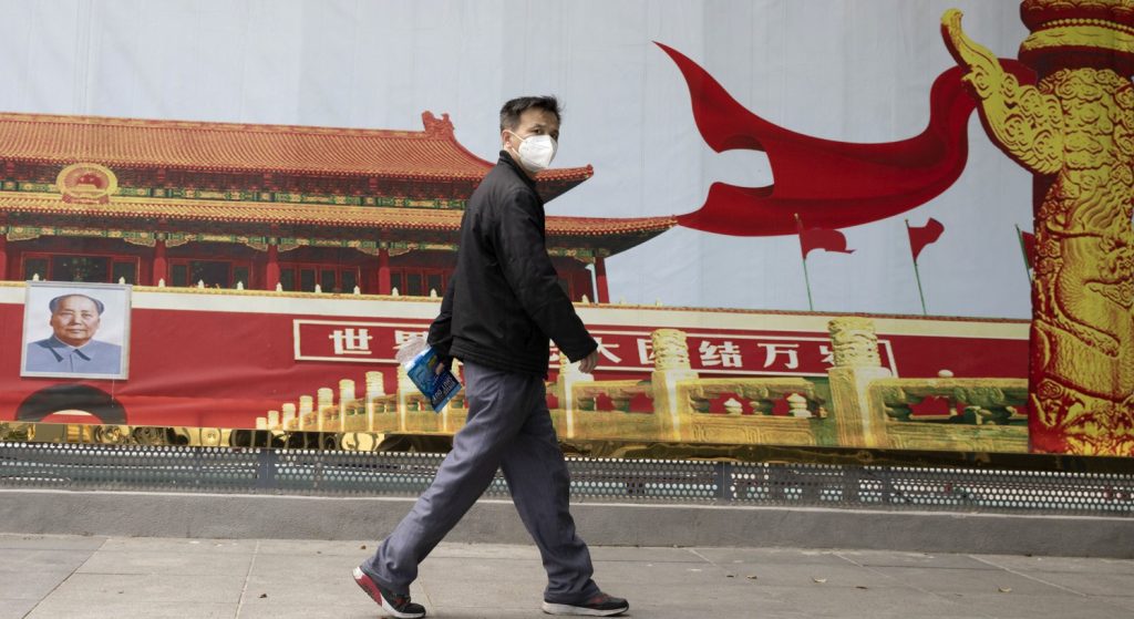 Cina lavoratore mascherina La Presse