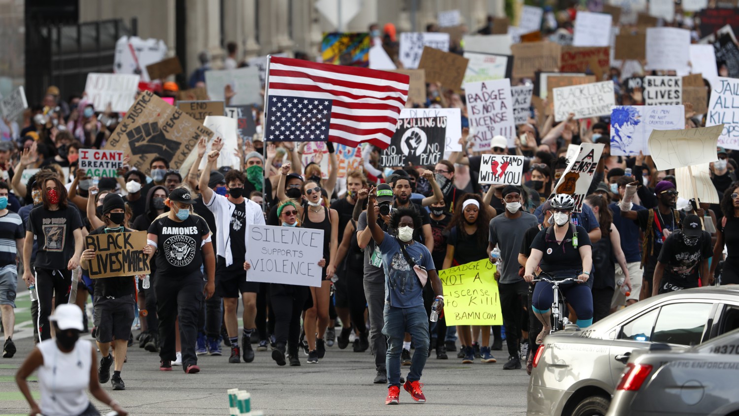 Protesters march after a rally in Detroit on Wednesday, June 3, 2020, over the death of George Floyd, a black man who died after being restrained by Minneapolis police officers on May 25 (AP Photo/Paul Sancya)