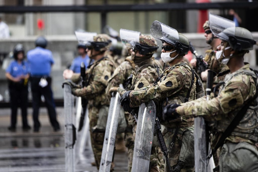 Pennsylvania National Guard and police stand guard in Philadelphia, Wednesday, June 3, 2020 as protest continue over the death of George Floyd, who died May 25 after he was restrained by Minneapolis police. (AP Photo/Matt Rourke)