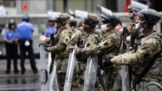 Pennsylvania National Guard and police stand guard in Philadelphia, Wednesday, June 3, 2020 as protest continue over the death of George Floyd, who died May 25 after he was restrained by Minneapolis police. (AP Photo/Matt Rourke)