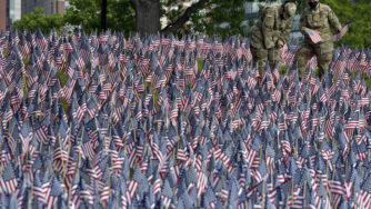 Air National Guard were among those planting American flags on Boston Common Wednesday, May 26, 2021
